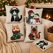 Christmas cat pillow covers styled on a sofa with holiday decorations