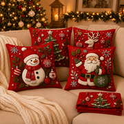 Christmas pillow covers displayed in a cozy holiday bedroom
